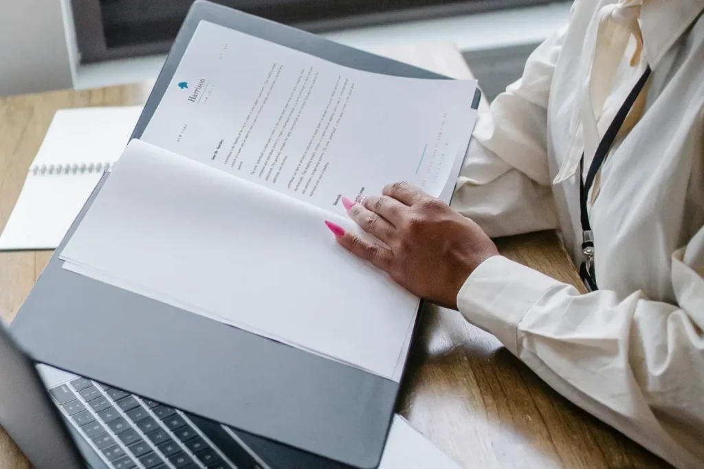 Manager reading a completed background screening report