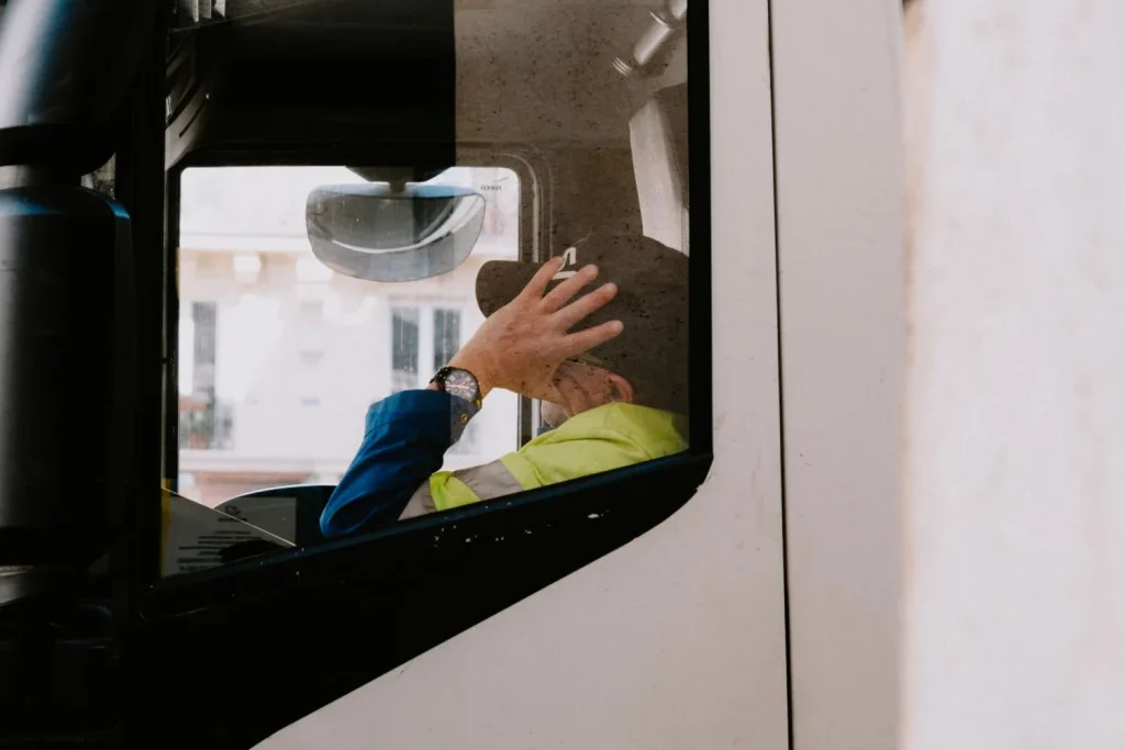 Driver taking a mandated rest break inside the vehicle cab
