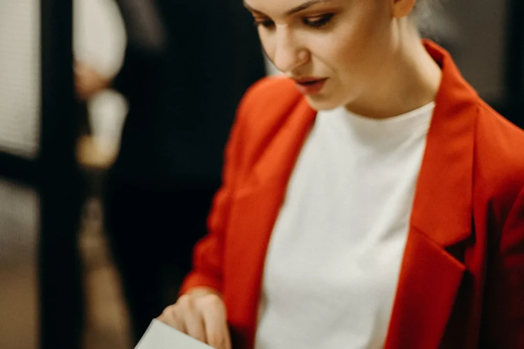 Compliance officer examining Level 2 background check documents