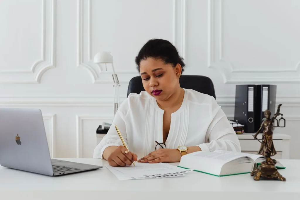 Notary public preparing documents at an office desk